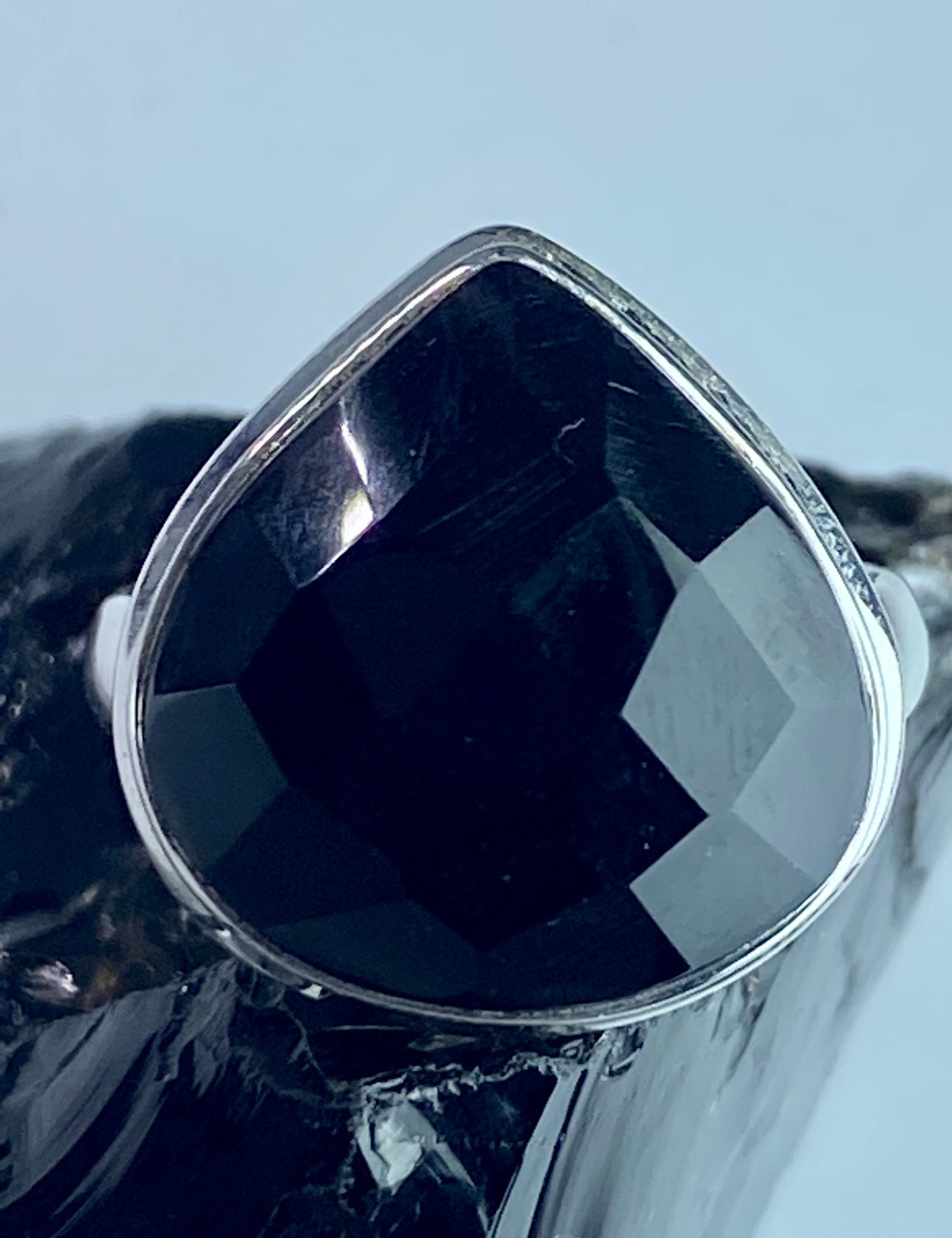 A Natural Black Faceted Tourmaline and Silver Ring (UV)