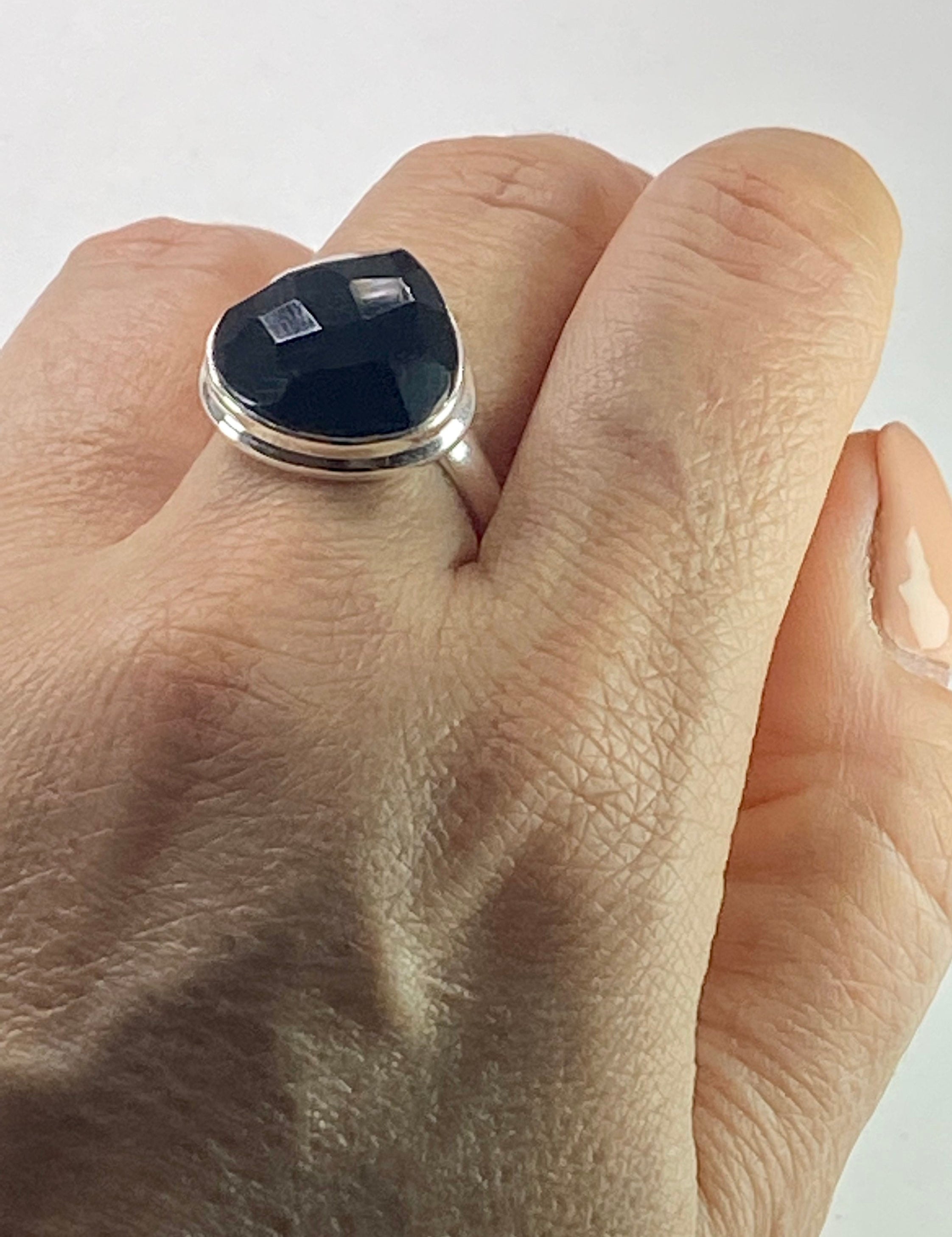 A Natural Black Faceted Tourmaline and Silver Ring (UV)