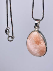 A High Grade Peach Scolecite and Silver Pendant.