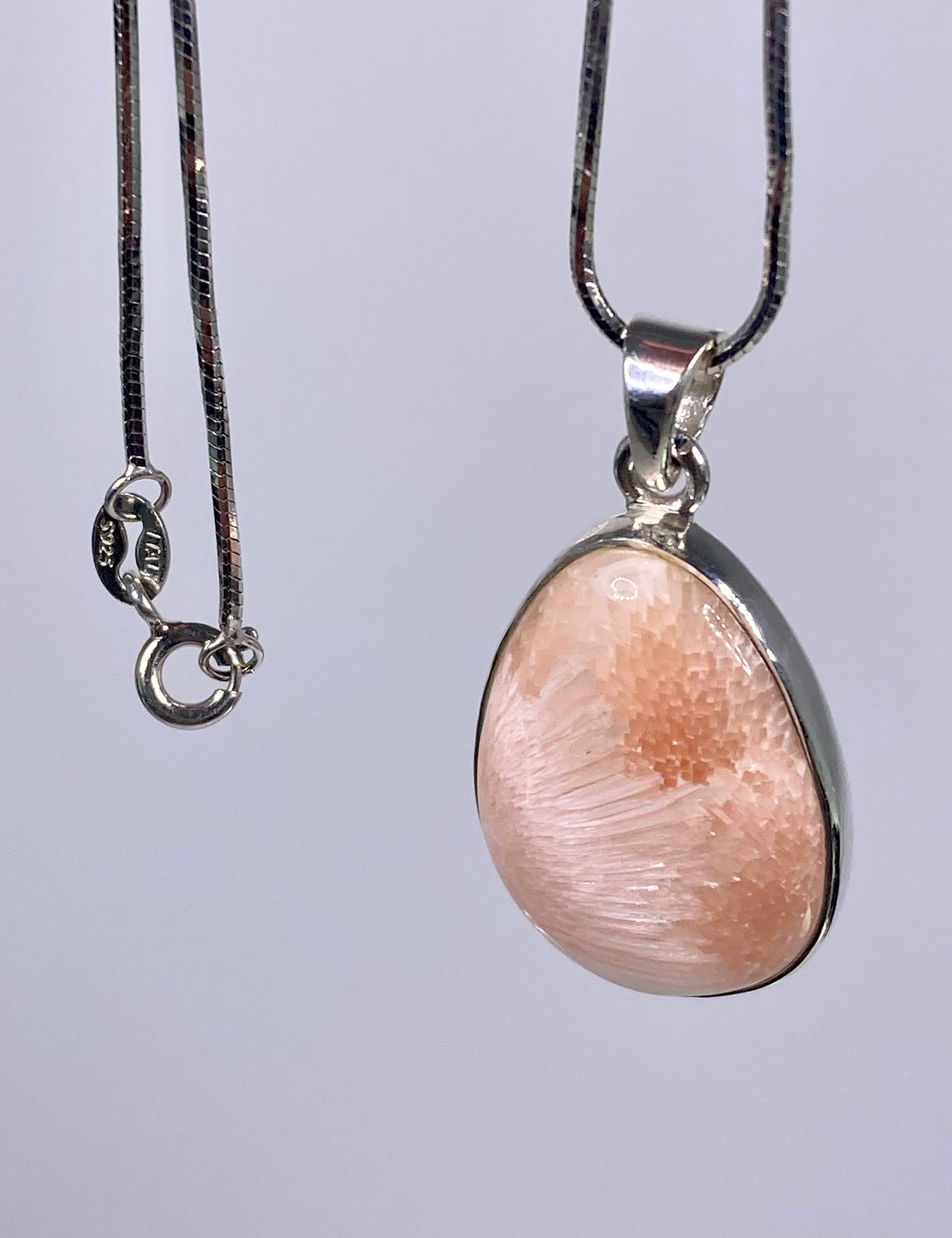 A High Grade Peach Scolecite and Silver Pendant.