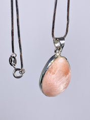 A High Grade Peach Scolecite and Silver Pendant.