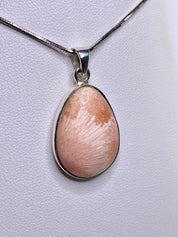 A High Grade Peach Scolecite and Silver Pendant.