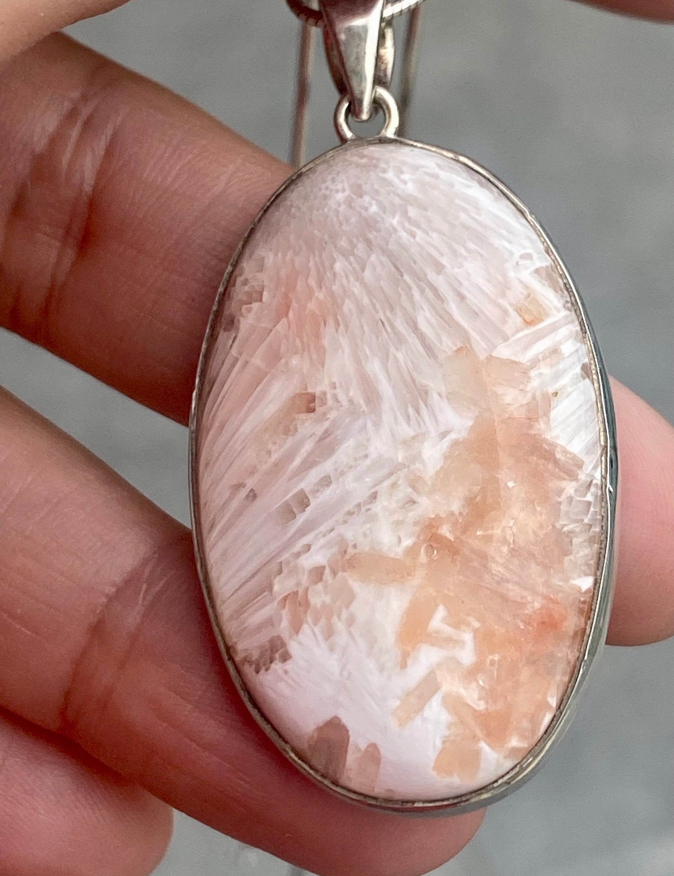 A High Grade Peach Scolecite and Silver Pendant.