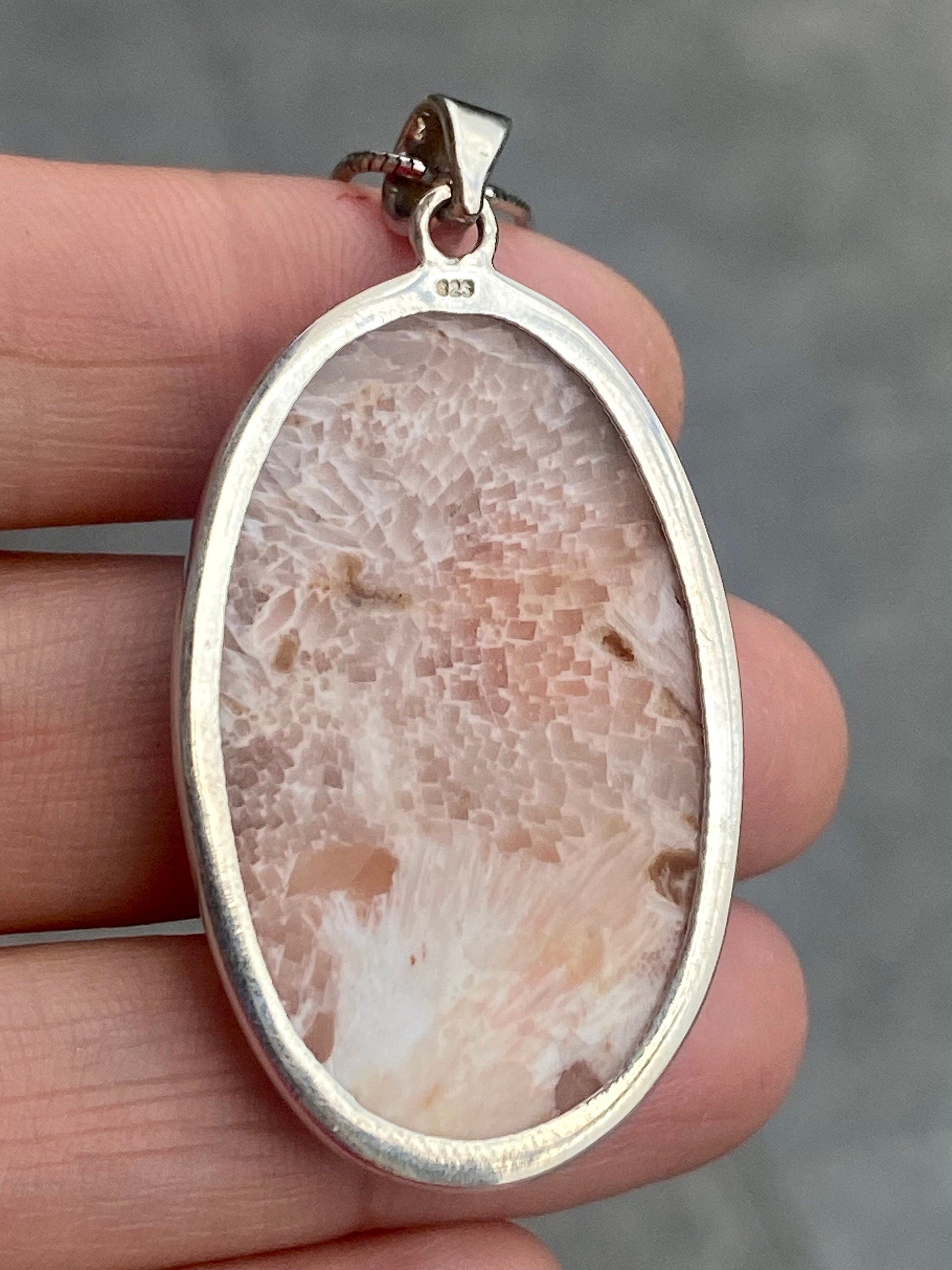 A High Grade Peach Scolecite and Silver Pendant.