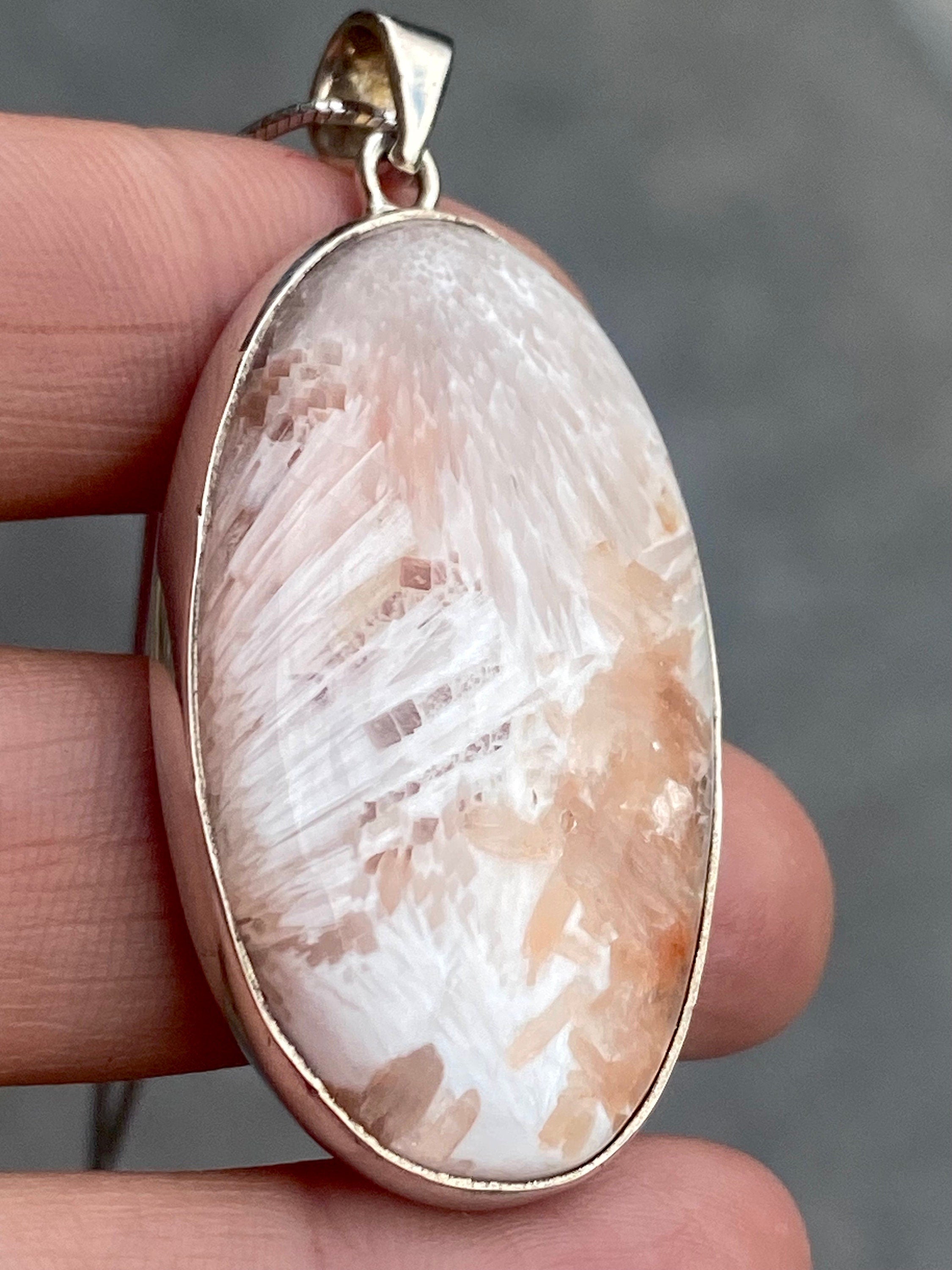 A High Grade Peach Scolecite and Silver Pendant.