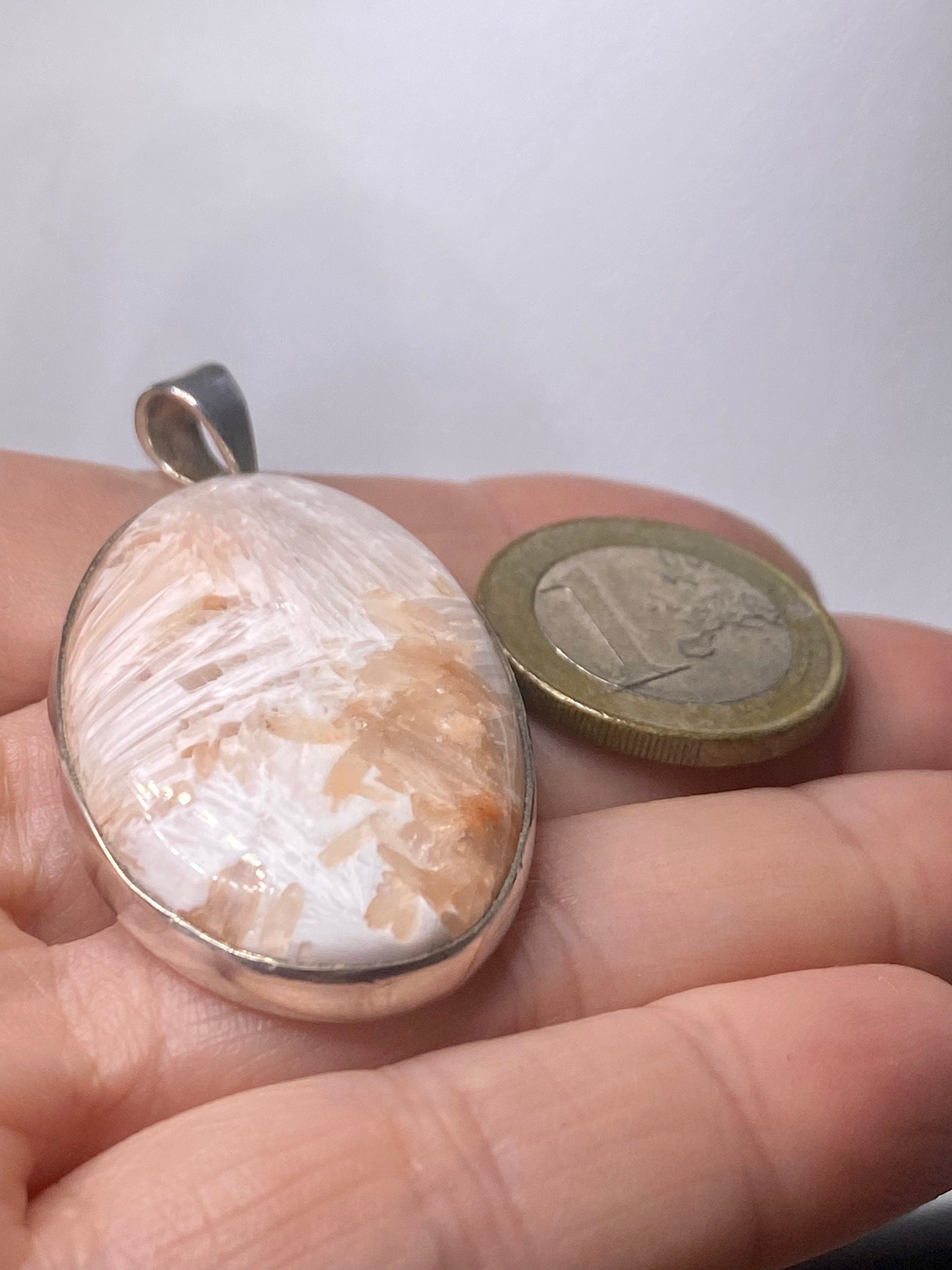 A High Grade Peach Scolecite and Silver Pendant.