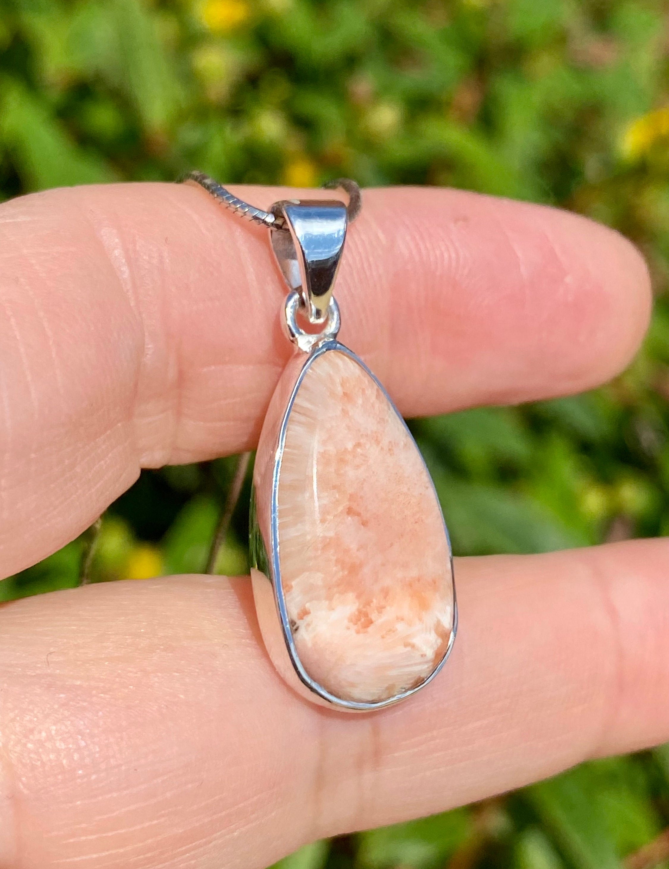 A High Grade Peach Scolecite and Silver Pendant.