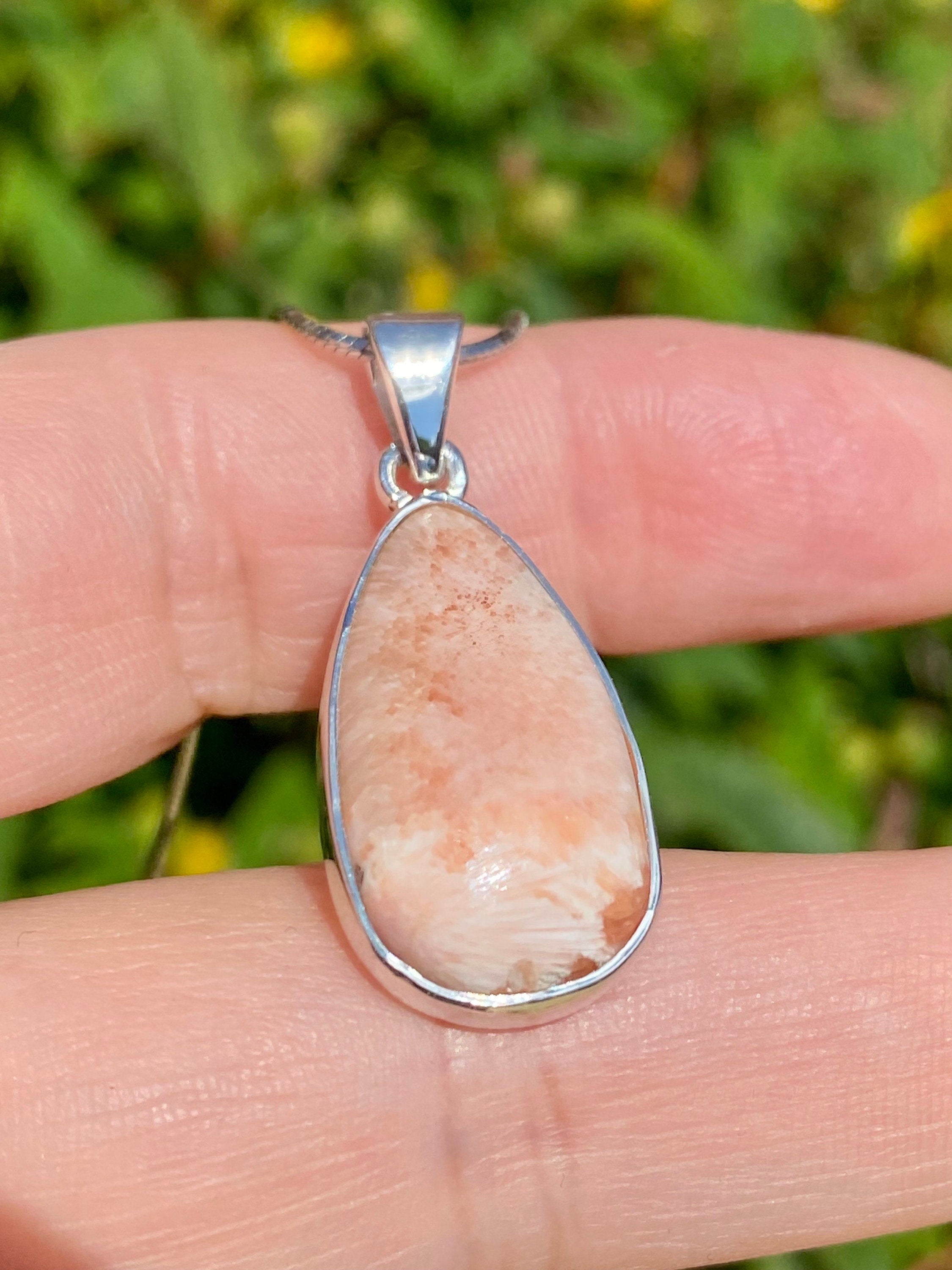 A High Grade Peach Scolecite and Silver Pendant.