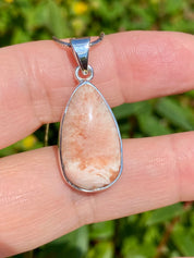 A High Grade Peach Scolecite and Silver Pendant.