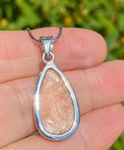 A High Grade Peach Scolecite and Silver Pendant.