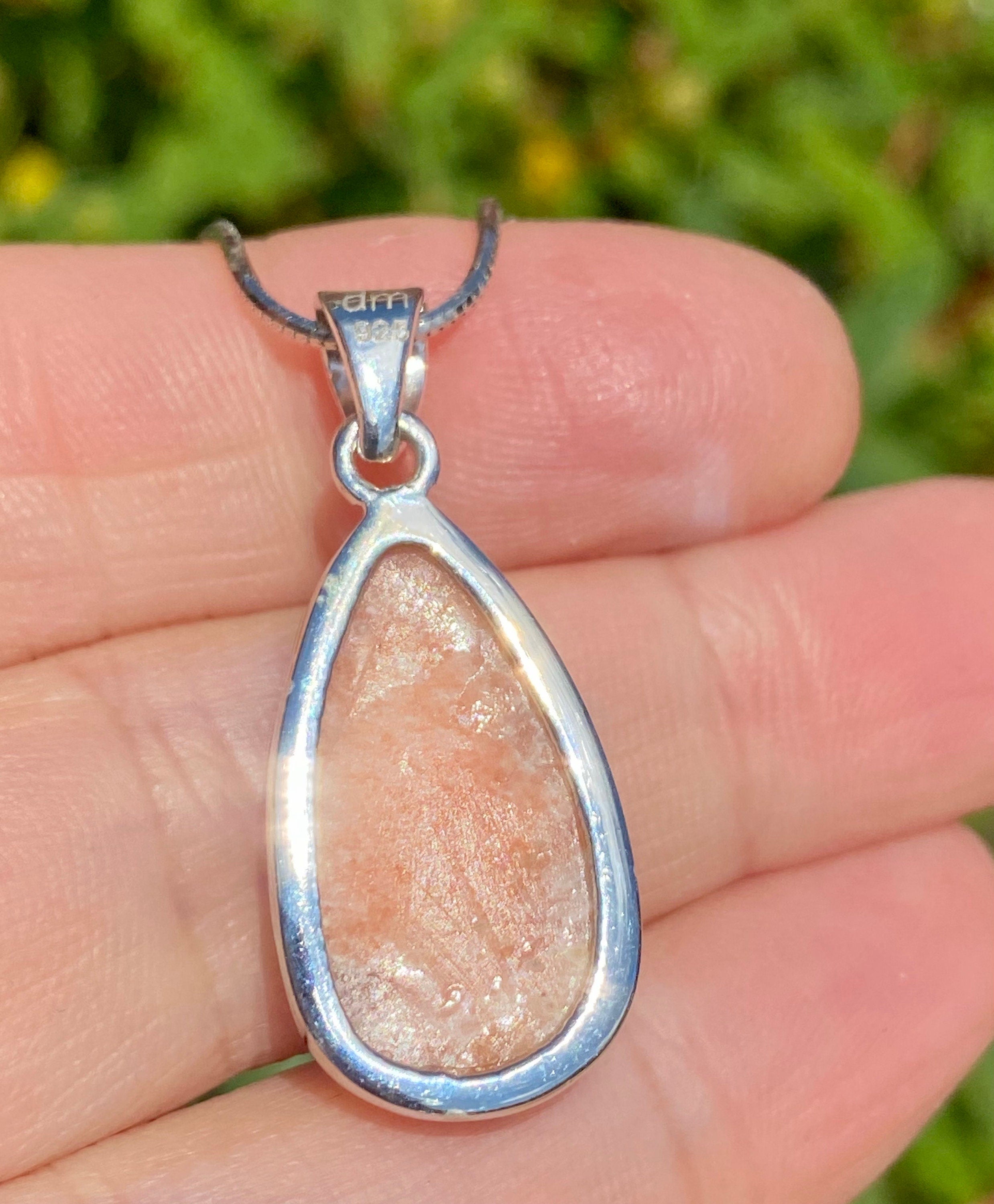 A High Grade Peach Scolecite and Silver Pendant.