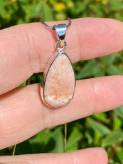 A High Grade Peach Scolecite and Silver Pendant.