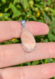 A High Grade Peach Scolecite and Silver Pendant.