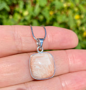 A High Grade Peach Scolecite and Silver Pendant.