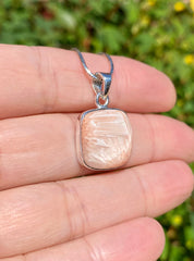 A High Grade Peach Scolecite and Silver Pendant.