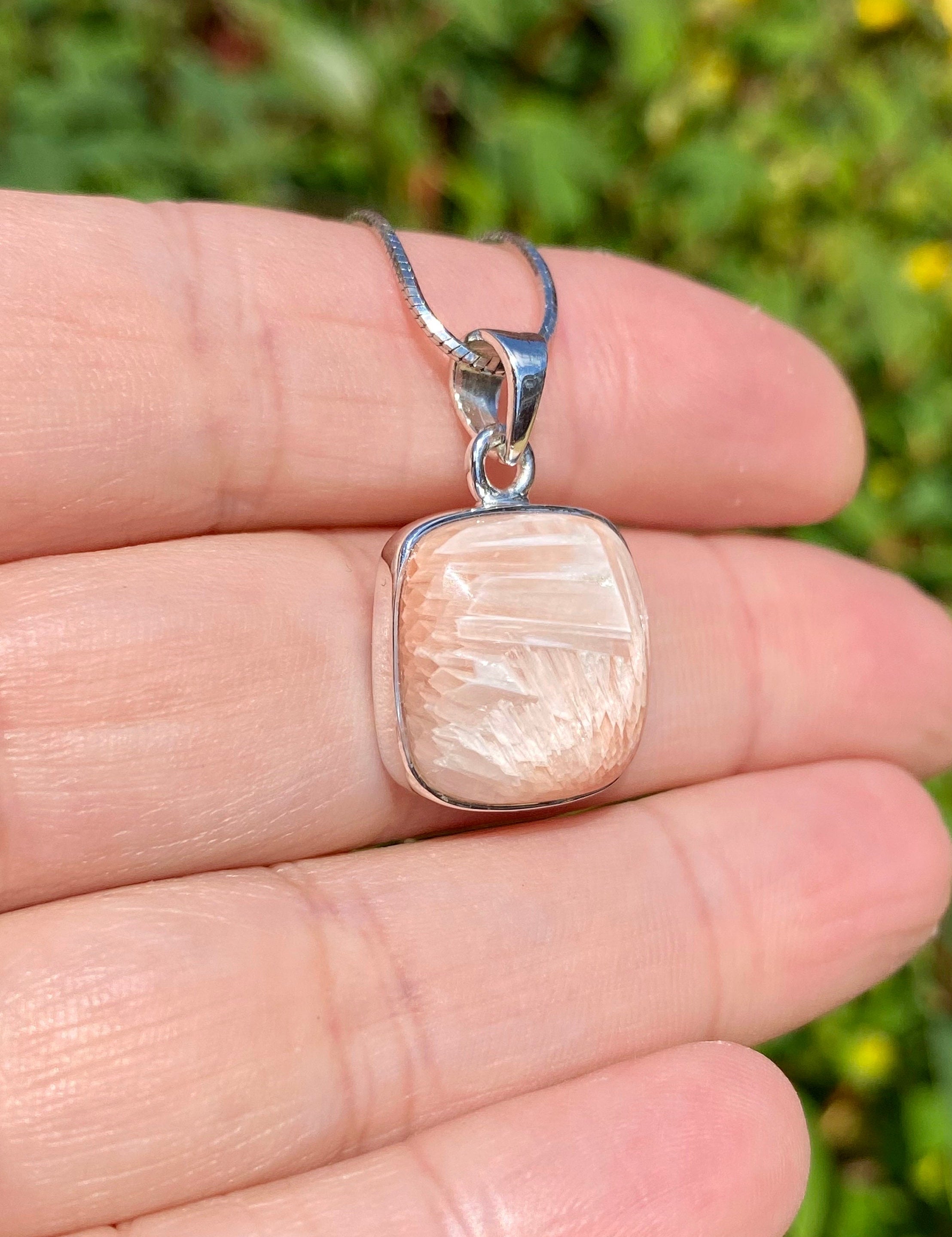 A High Grade Peach Scolecite and Silver Pendant.