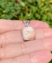 A High Grade Peach Scolecite and Silver Pendant.