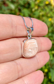 A High Grade Peach Scolecite and Silver Pendant.