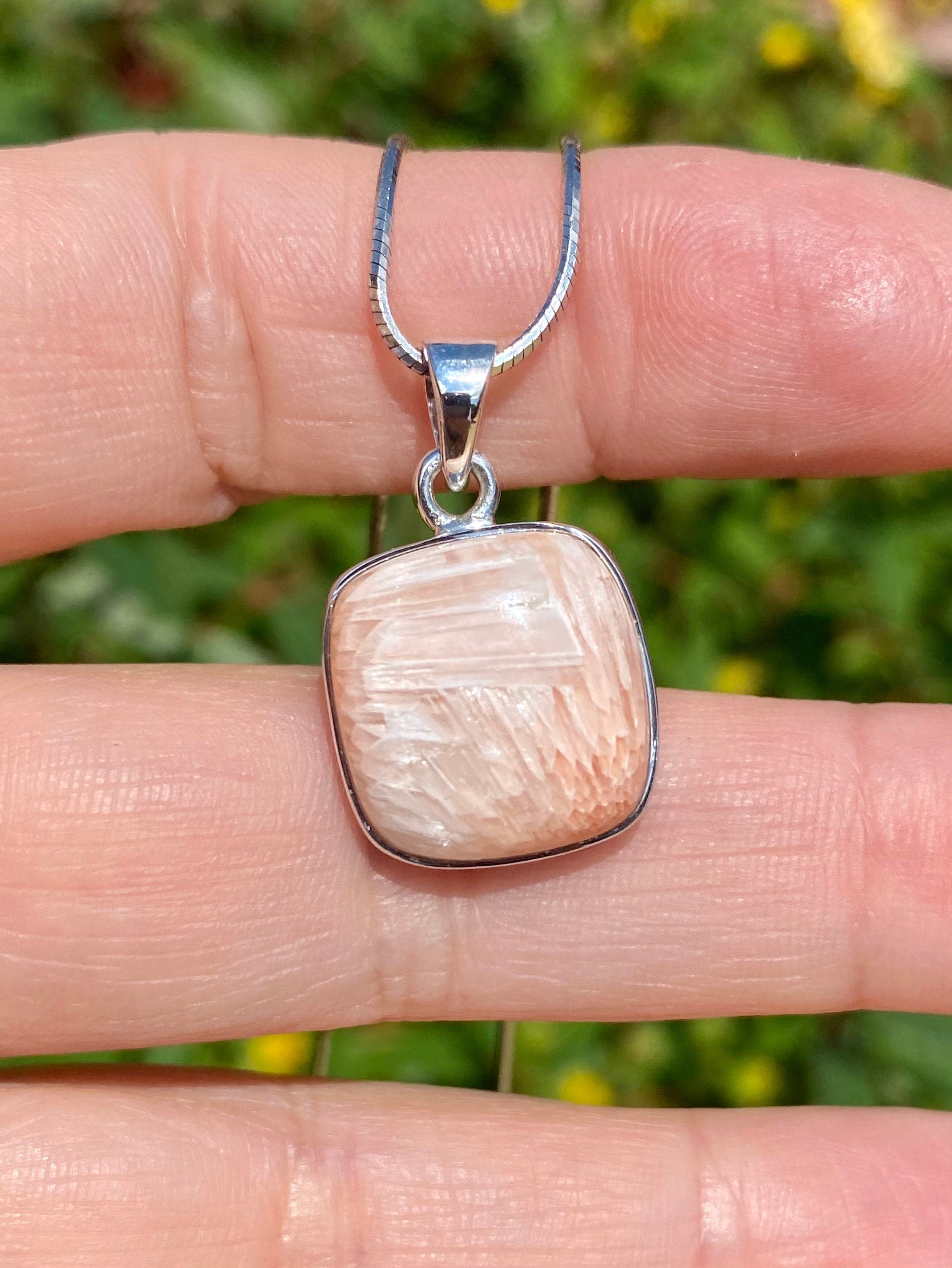 A High Grade Peach Scolecite and Silver Pendant.