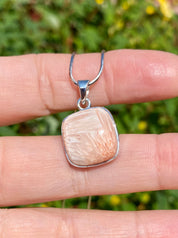 A High Grade Peach Scolecite and Silver Pendant.