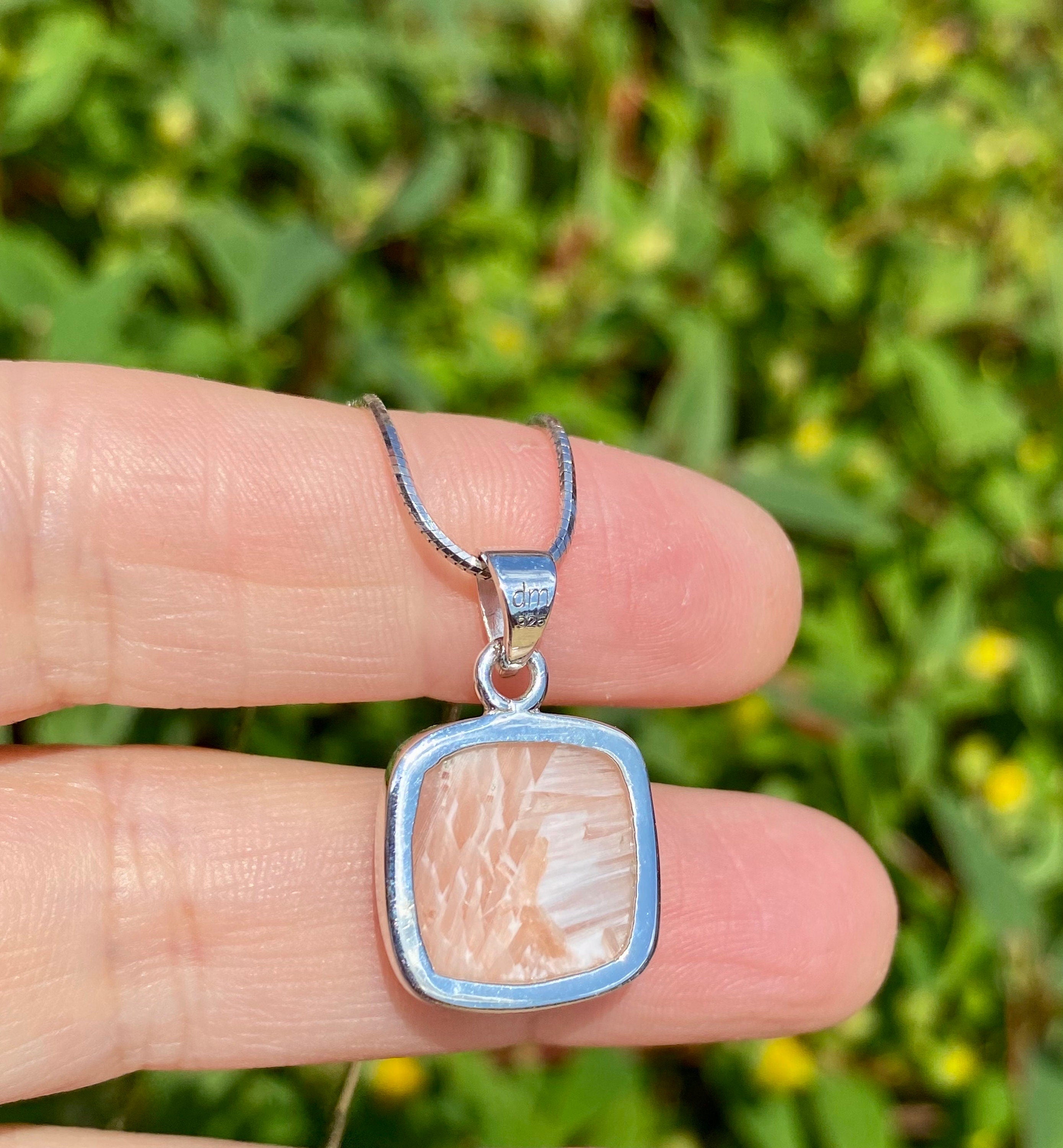 A High Grade Peach Scolecite and Silver Pendant.