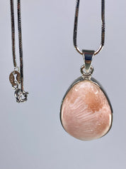 A High Grade Peach Scolecite and Silver Pendant.