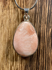 A High Grade Peach Scolecite and Silver Pendant.