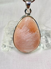 A High Grade Peach Scolecite and Silver Pendant.