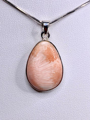 A High Grade Peach Scolecite and Silver Pendant.