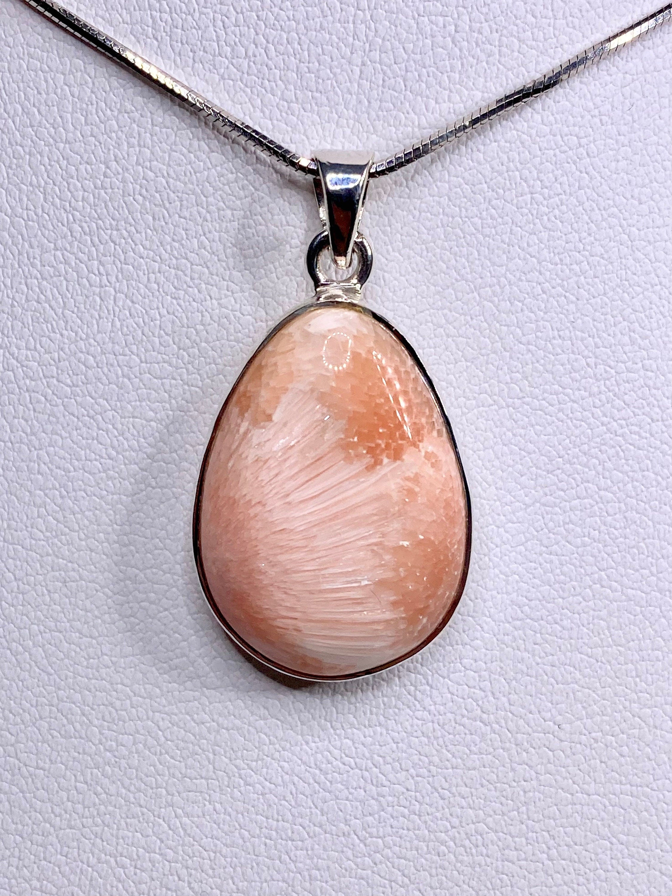 A High Grade Peach Scolecite and Silver Pendant.