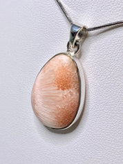 A High Grade Peach Scolecite and Silver Pendant.