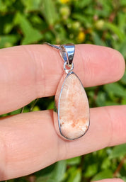 A High Grade Peach Scolecite and Silver Pendant.