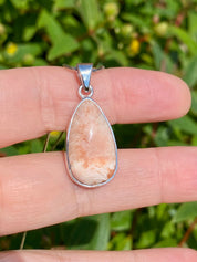 A High Grade Peach Scolecite and Silver Pendant.