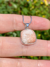 A High Grade Peach Scolecite and Silver Pendant.