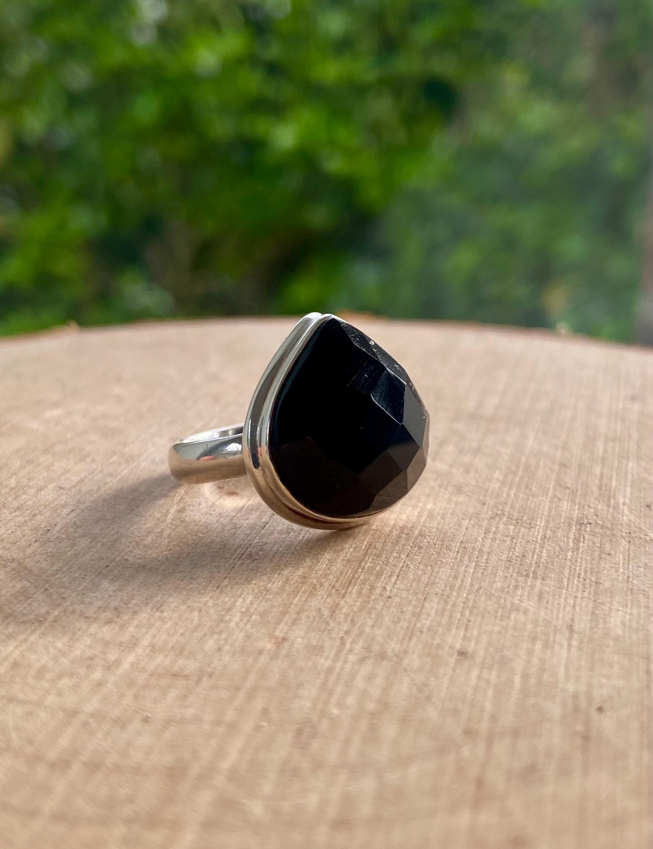 A Natural Black Faceted Tourmaline and Silver Ring (UV)