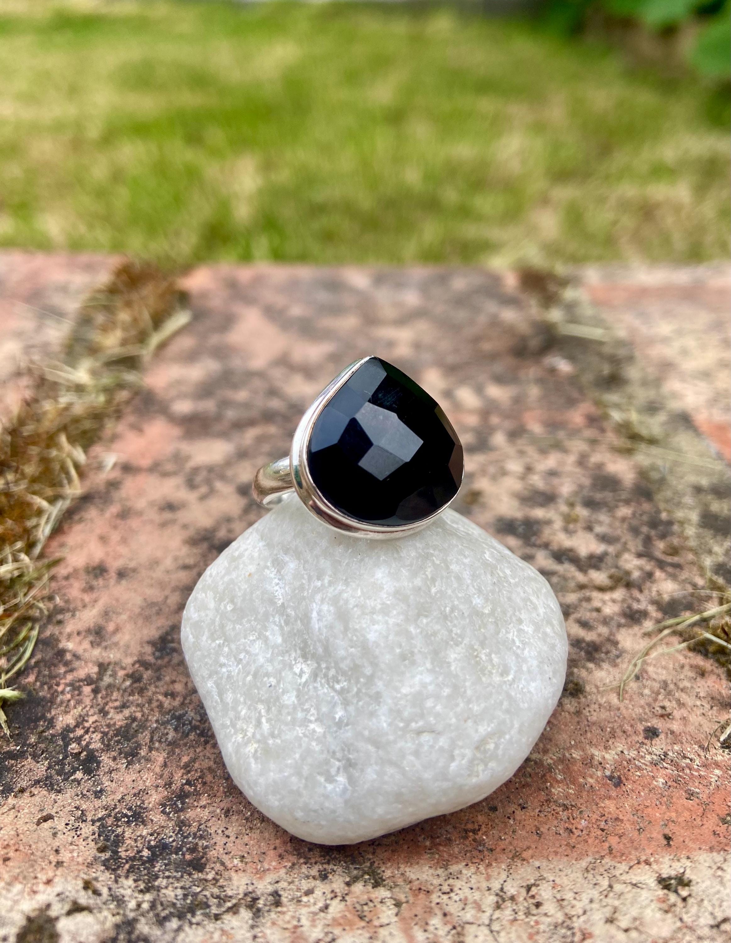 A Natural Black Faceted Tourmaline and Silver Ring (UV)