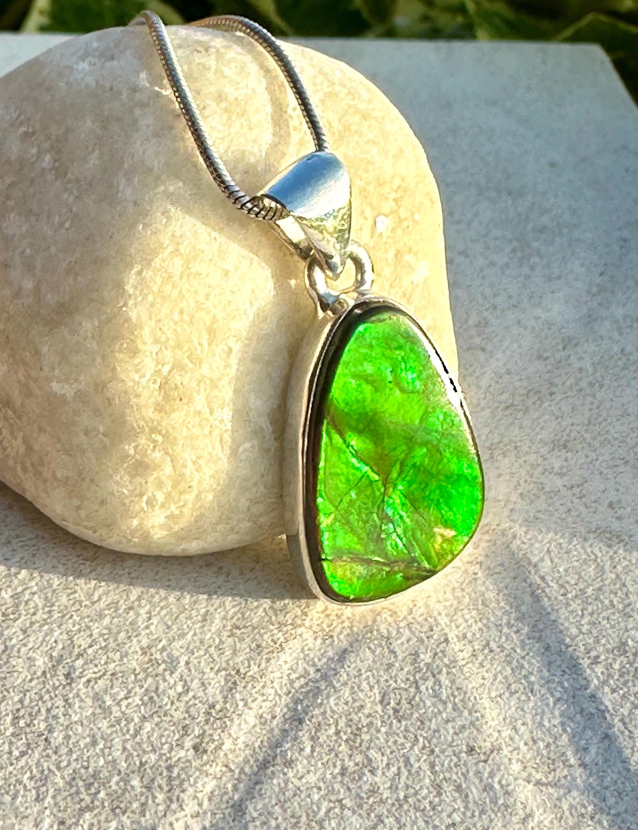 Iridescent Ammolite Pendant: Sterling Silver Pear-Cut Gemstone