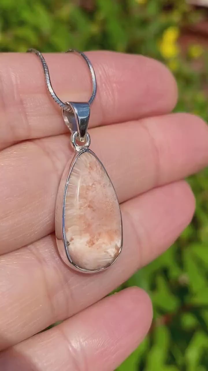 A High Grade Peach Scolecite and Silver Pendant.